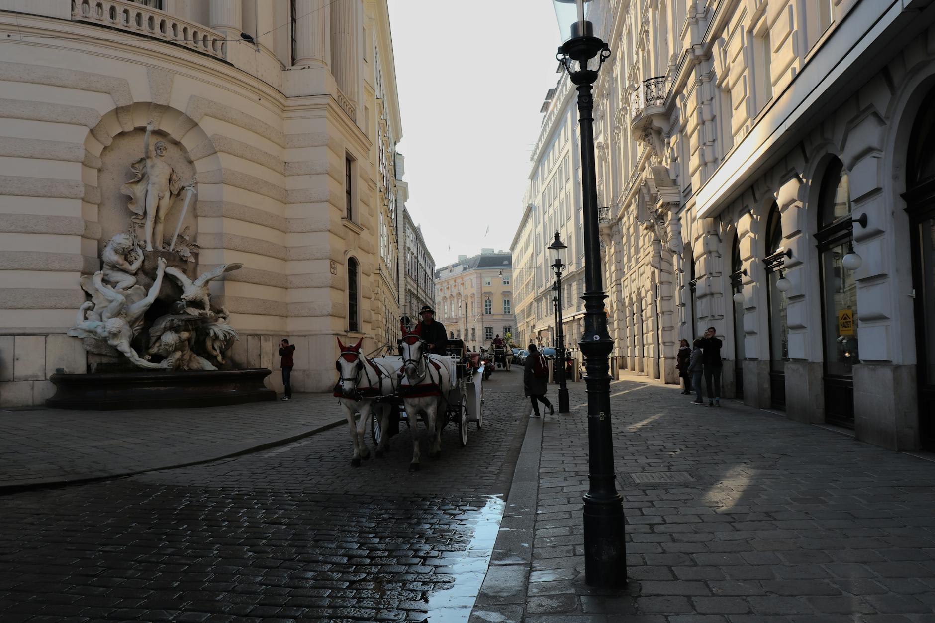 Austria Vienna - Property of: Nuray, A horse drawn carriage is on a cobblestone street