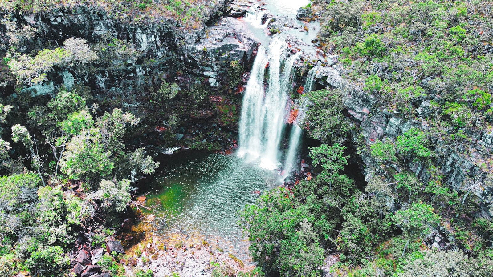 water falls in the middle of the forest - Cachoeiras na Chapada dos Veadeiros